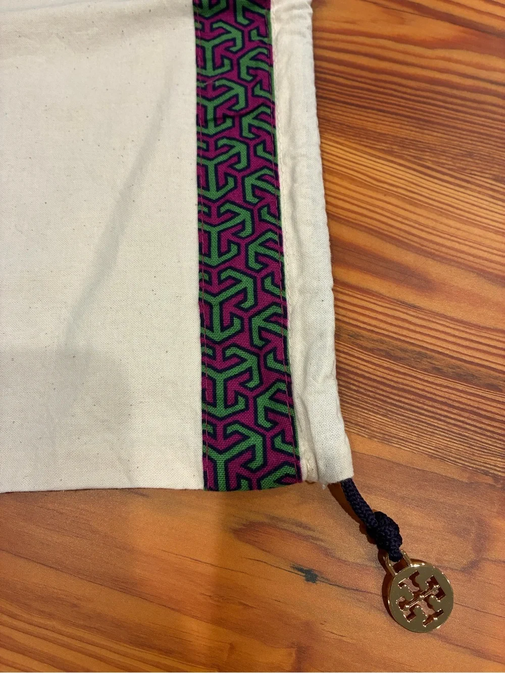 Tory Burch Cream Dust Bag with Purple & Green Trim and Gold Logo Charm